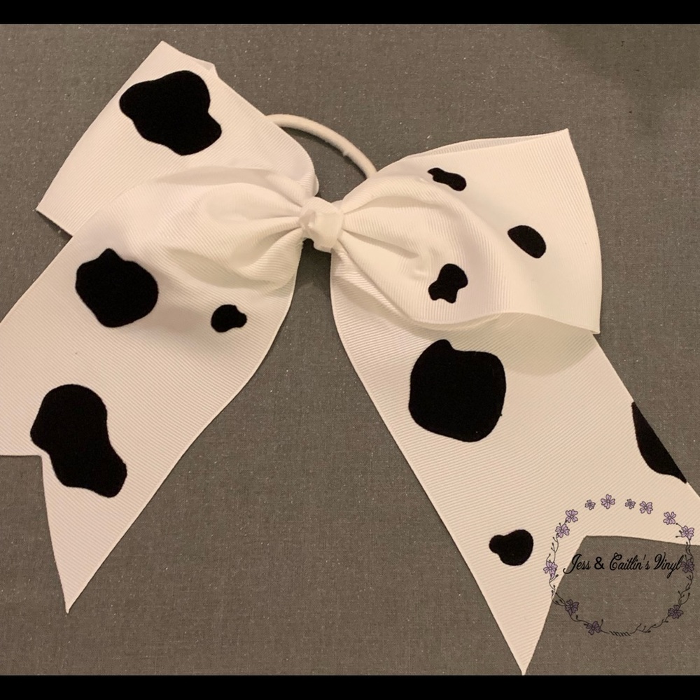 Handmade cowprint bows/hair ties.